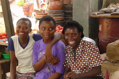 Young women hang out together in Makola Market, Accra, Ghana.