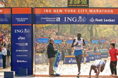 Kenya's Paul Tergat taking the tape ahead of Hendrick Ramaala to become the ING New York City Marathon 2005 men's champion.
