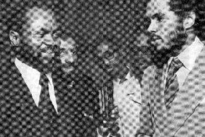 Robert Van Lierop, right, presents a check to President Samora Machel of Mozambique at the United Nations in 1977 . The funds, raised from Van Lierop's film showings across the country, went to build a health clinic in rural Niassa province. In the background, from left, are Valeriano Ferrpo, James Garrett, and an unidentified man.