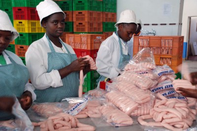 Workers packaging meat products in Nairobi (file photo).