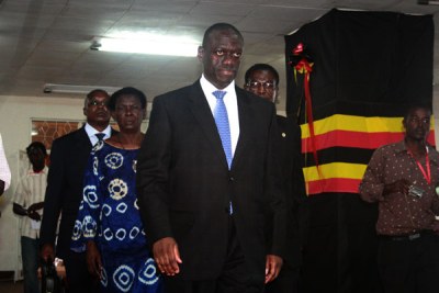 Col. Kiza Besigye arrives at Namboole for nominations (file photo).