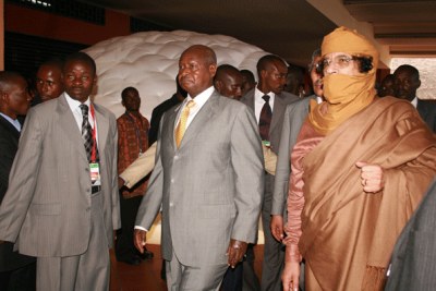 Ugandan president Yoweri Museveni with former Libyan leader Muammar Gaddafi during an AU summit (file photo).