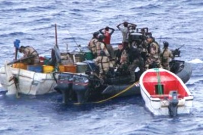 Suspected Somali pirates apprehended by a patrol of the EU Naval Force Somalia (EUNAVFOR), one of several initiatives to combat piracy against international shipping off the coast of Somalia.