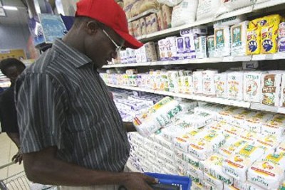 A consumer buying flour (file photo): A policy think tank says that the Price Control Bill is not the solution to the problems facing consumers.