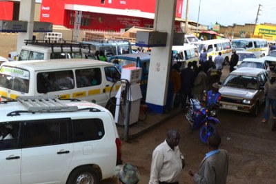 Motorists line up for fuel at a petrol station, after many petrol station ran out of fuel (file photo).