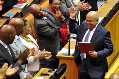 South Africa's Minister of Finance, Pravin Gordhan, right, in Parliament.
