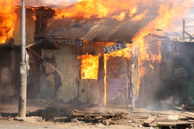 A barbershop burns in Nairobi's Mathare slum in post-election violence, December 31, 2007.