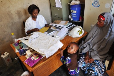 A mother consults a nurse: Uganda considered the most corrupt in healthcare in East Africa region.