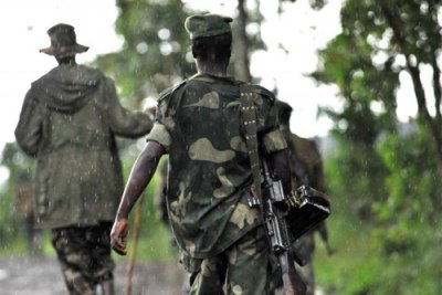 Rebels (file photo): Three people have been killed at the DR Congo, Uganda border according to security sources.