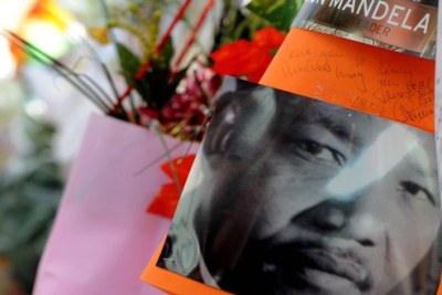 Flowers and messages in memory of Nelson Mandela (file photo).