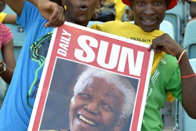 Nelson Mandela smiles during a meeting in Johannesburg in this file photo dated 2 June 2009. Mandela celebrates his 94th birthday on Wednesday.