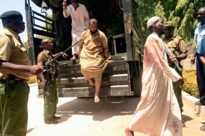 Youth arrested during the Masjid Musa operation are escorted by security forces to court in Shanzu, Mombasa (file photo).