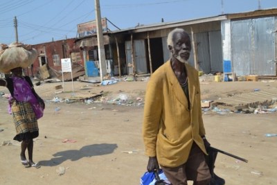 A man and his daughter return to Bor town, Jonglei state after the fierce fighting in the state and across the country (file photo)