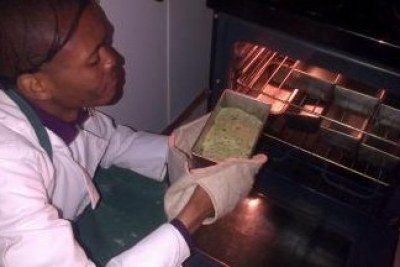 Lufefe Nomjana bakes his batch of spinach bread (file photo).