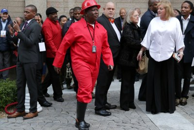 Economic Freedom Fighters' leader Julius Malema clad in overalls, gumboots and hard hat at the State of the Nation at Parliament in Cape Town, 2014.