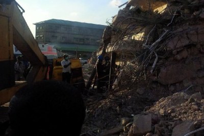 Nigerian recovery workers at the scene of the collapsed church guest house in Lagos (file photo).