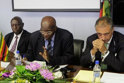 From left, Deputy Finance Minister Samuel Undenge, Finance Minister Patrick Chinamasa and IMF's Domenico Fanizza.