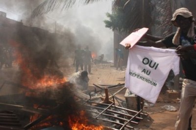 A protester burns a T-shirt supporting a referendum on constitutional changes to allow the president to stand for re-election in 2015 (file photo).