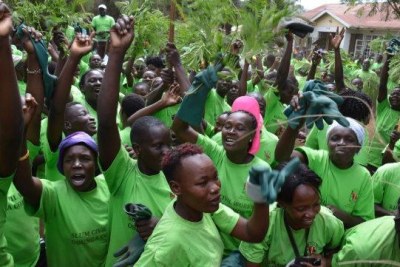 Youth and women from Obunga slum in Kisumu demonstrate in support of Devolution CS Anne Waiguru on Tuesday.