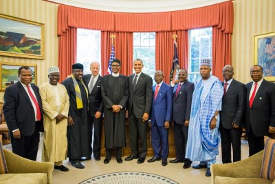 Presidents Obama and Buhari with aides following Oval Office meeting.