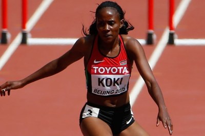 Francisca Koki in action during her women 400m Hurdles heat in Beijing.