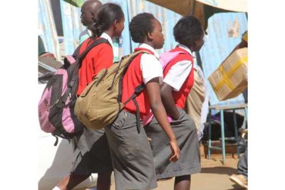 Students from Kapsabet Girls Secondary School in Nandi County spotted in Eldoret Town on September 16, 2015, on their way home. With the teachers' strike showing no sign of ending, the government has ordered that all public and private schools be closed starting September 21, 2015.