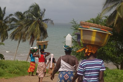 Walking to the ocean in Lungi, Port Loko, Sierra Leone.