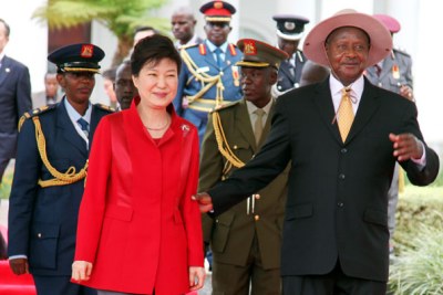President Museveni (L) welcomes his South Korean counterpart Park Geun-Hye to State House Entebbe on last weekend.