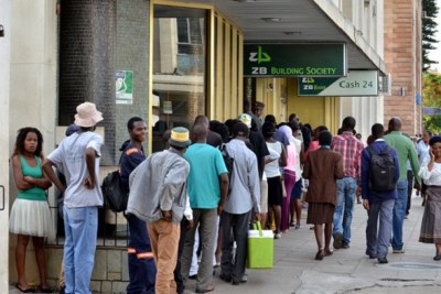 People at a bank waiting for service in Zimbabwe (file photo).