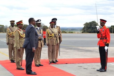 President Peter Mutharika inspects guard of honour (file photo).