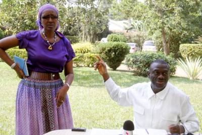 Former Forum for Democratic Change presidential candidate Kizza Besigye and wife Winnie Byanyima address journalists at their home in Kasangati, Wakiso District.