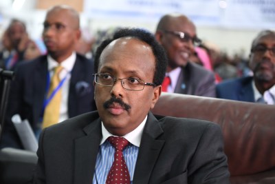 Mohamed Abdullahi Farmajo listens keenly as members of the Presidential Elections Committee count ballots cast during the presidential election at the Mogadishu Airport hangar on February 8, 2017. Farmajo was declared the president of Somalia after incumbent Hasan Sheikh Mohamud conceded defeat.