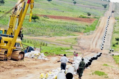 A man walks along the already set 20-inch 450km Kenya Pipeline Company [KPC} pipes at Kokotoni in this picture taken on July 15, 2015. File photo: Nation Media Group