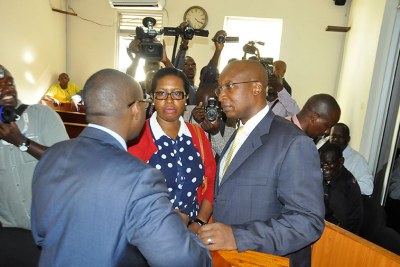 Herbert Kabafunzaki talking to one of his lawyers.