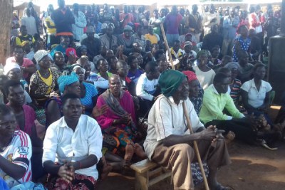 Residents of Apaa Trading Centre in Zoka Village, Amuru District attend a meeting.