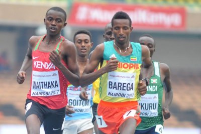 Kenya's Stanley Waithaka (left) battles Ethiopia's Barega Selemon in 3000m Heat One during the IAAF World Under-18 Athletics Championship.