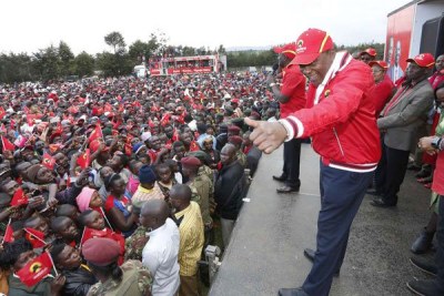 President Uhuru Kenyatta greets supporters who turned up for a Jubilee rally in Samata Nadara, Nayandarua County, on October 7, 2017.