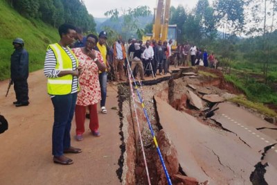 Uganda roads agency executive director Allen Kagina  and team visit the damaged section of the Kabale- Katuna road.