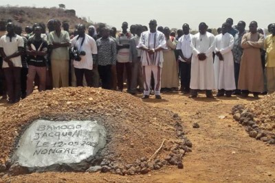 Burial of a priest killed in previous attacks.