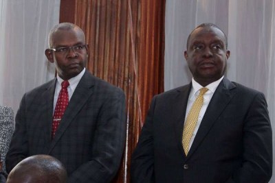 Treasury Cabinet Secretary Henry Rotich (right) and his Principal Secretary Kamau Thugge at a Milimani court in Nairobi on July 23, 2019.