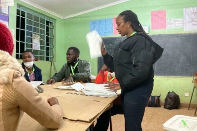 At Garden City Estate, an affluent neighbourhood in Nairobi, Sarah Muthoni, polling station presiding officer for stream five, counts each ballot under the scrutiny of the political party agents.