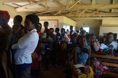 Mothers queue to have their children vaccinated against malaria at Likuni Community Hospital in Lilongwe, Malawi.