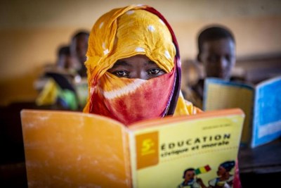 A child reads a book at a school in Kidal, Mali.